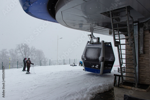 Strong snowfall in Tufandag, Gabala - Azerbaijan. Winter holiday. Skiers and cable car.