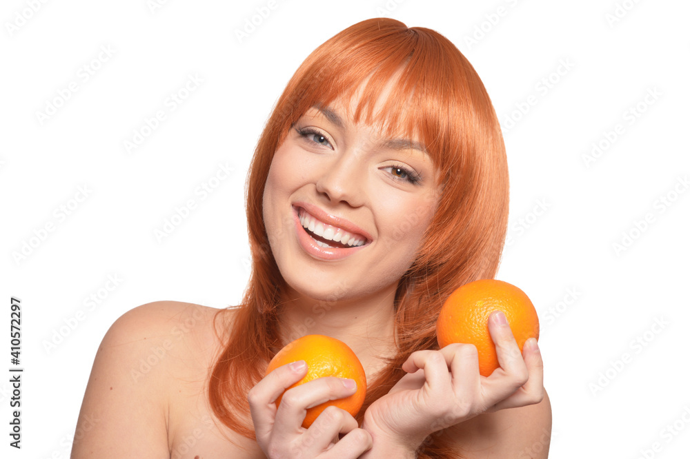 Portrait of young woman posing with oranges Portrait of young woman posing with oranges