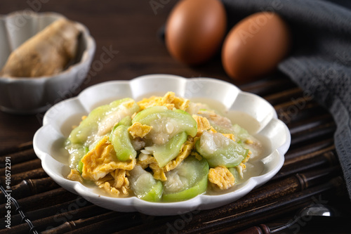 Taiwanese homemade local food of scrambled eggs with loofah gourd and sesame oil.