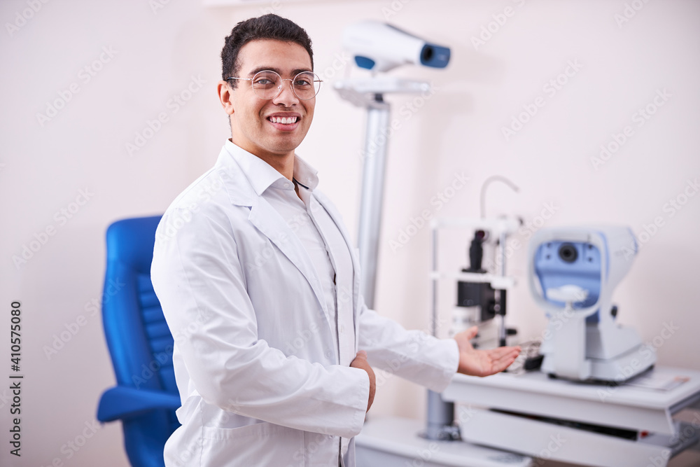 Friendly smiling ophthalmologist looking at the camera