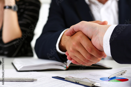 Man in suit shake hand as hello in office closeup. Friend welcome, mediation offer, positive introduction, greet or thanks gesture, summit participate approval, motivation, strike arm bargain concept