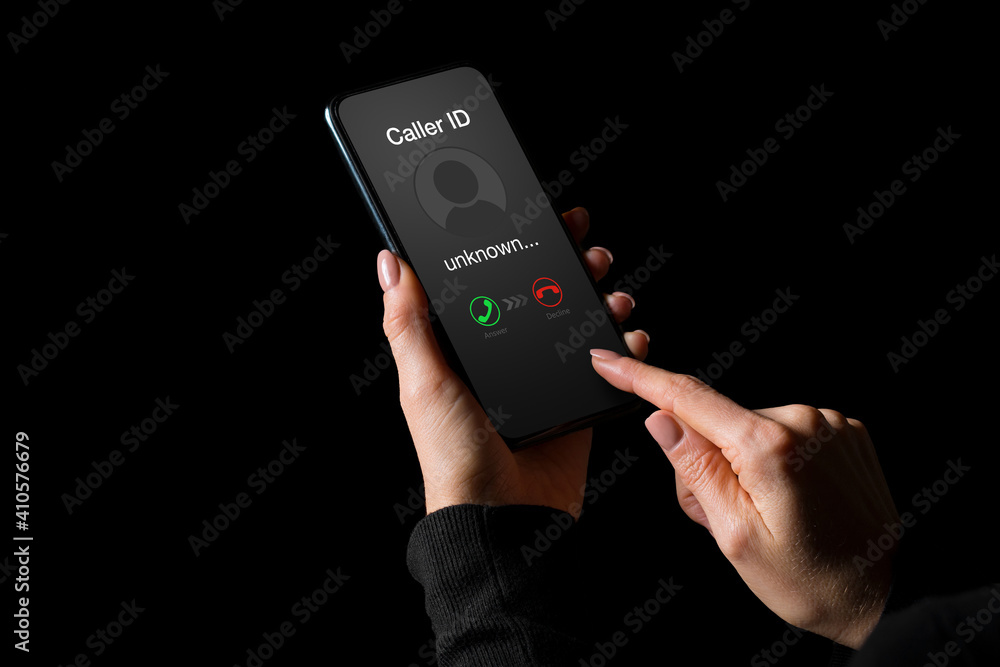 Person getting a call on phone from an unknown number Person getting a call on phone from an unknown number