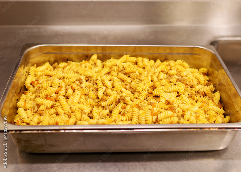 boiled pasta with meat and toppings in a metal pan, cooking boiled pasta with meat and toppings in a metal pan, cooking