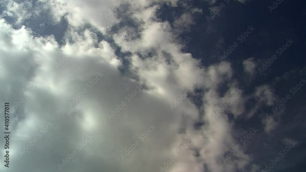 Time-lapse of cumulous clouds moving in blue sky. Time-lapse of cumulous clouds moving in blue sky.