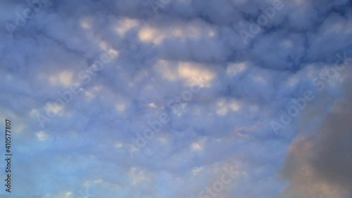 Time-lapsed shot of clouds at sunset.
