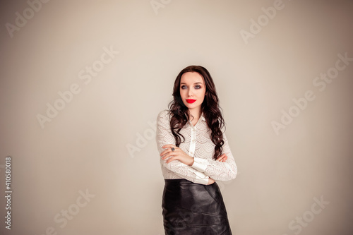 portrait of a beautiful young brunette with long hair. businesswoman