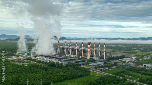 Wallpaper Mural Hyper lapse video 4K, Aerial view Steam or mist over of Power Plant with smoke and toxic air from cooling, Electric of energy, Air pollution environment concept, Lampang Thailand. Torontodigital.ca