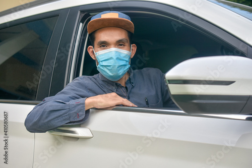 Asian man wear medical mask sitting in car to protect coronavirus covid19 ,Mask prevent PM2.5