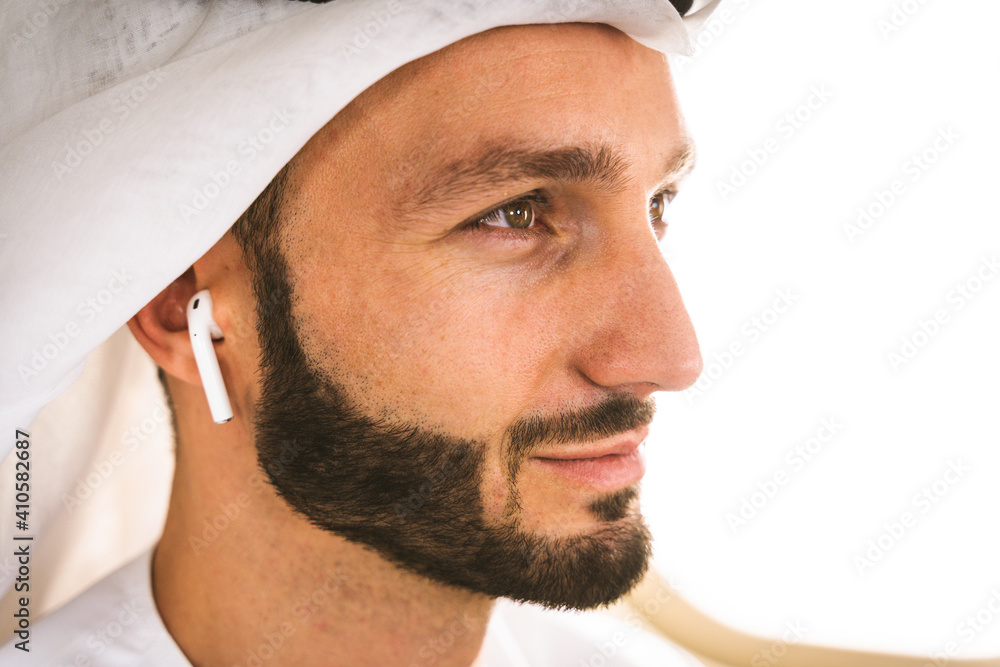 Arabian man wearing kandora flying on private jet Arabian man wearing kandora flying on private jet