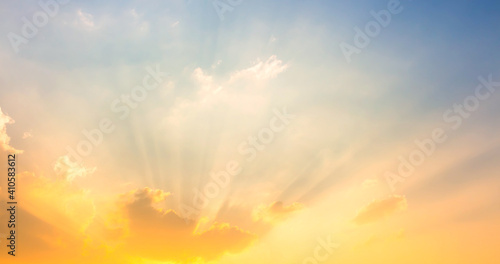 sky and clouds nature background yellow sun light on sky with sun rays © Passakorn