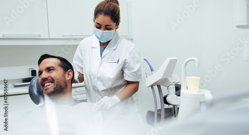 Male patient smiling in dentist s chair