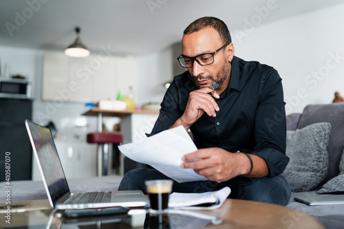 40 years old man accounting at home