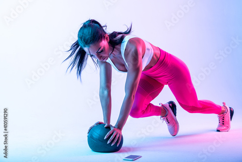 Woman training with the exercizes ball in the gym photo
