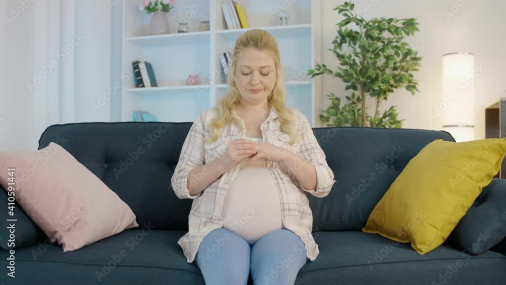 Sad expecting woman taking off wedding ring, divorce during pregnancy, breakup Sad expecting woman taking off wedding ring, divorce during pregnancy, breakup