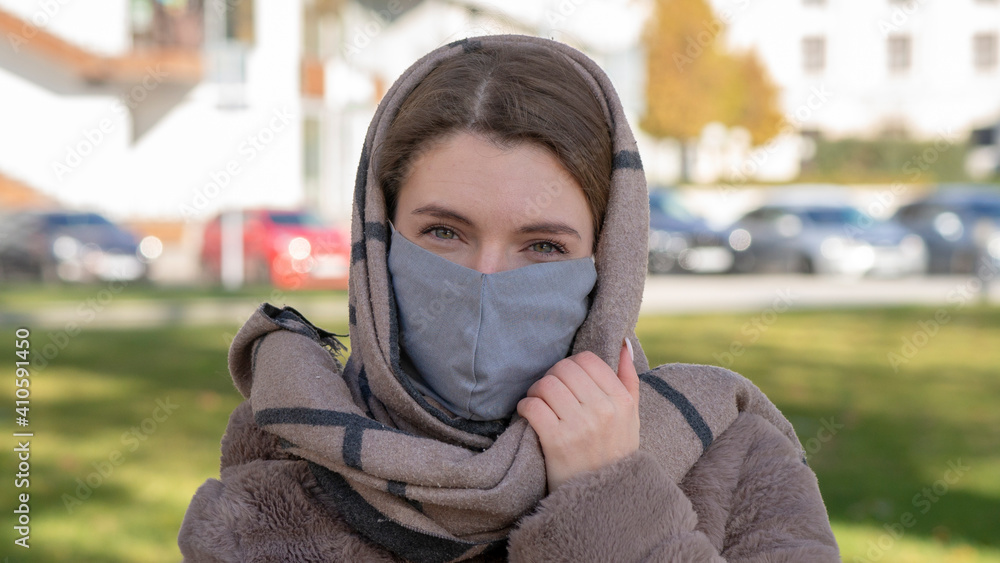 Beautiful stylish girl wear medical face mask on sunny city street. Young elegant happy hipster woman put on protective face mask outdoors. Urban fashion outfit, lifestyle. COVID-19 quarantine, travel Beautiful stylish girl wear medical face mask on sunny city street. Young elegant happy hipster woman put on protective face mask outdoors. Urban fashion outfit, lifestyle. COVID-19 quarantine, travel