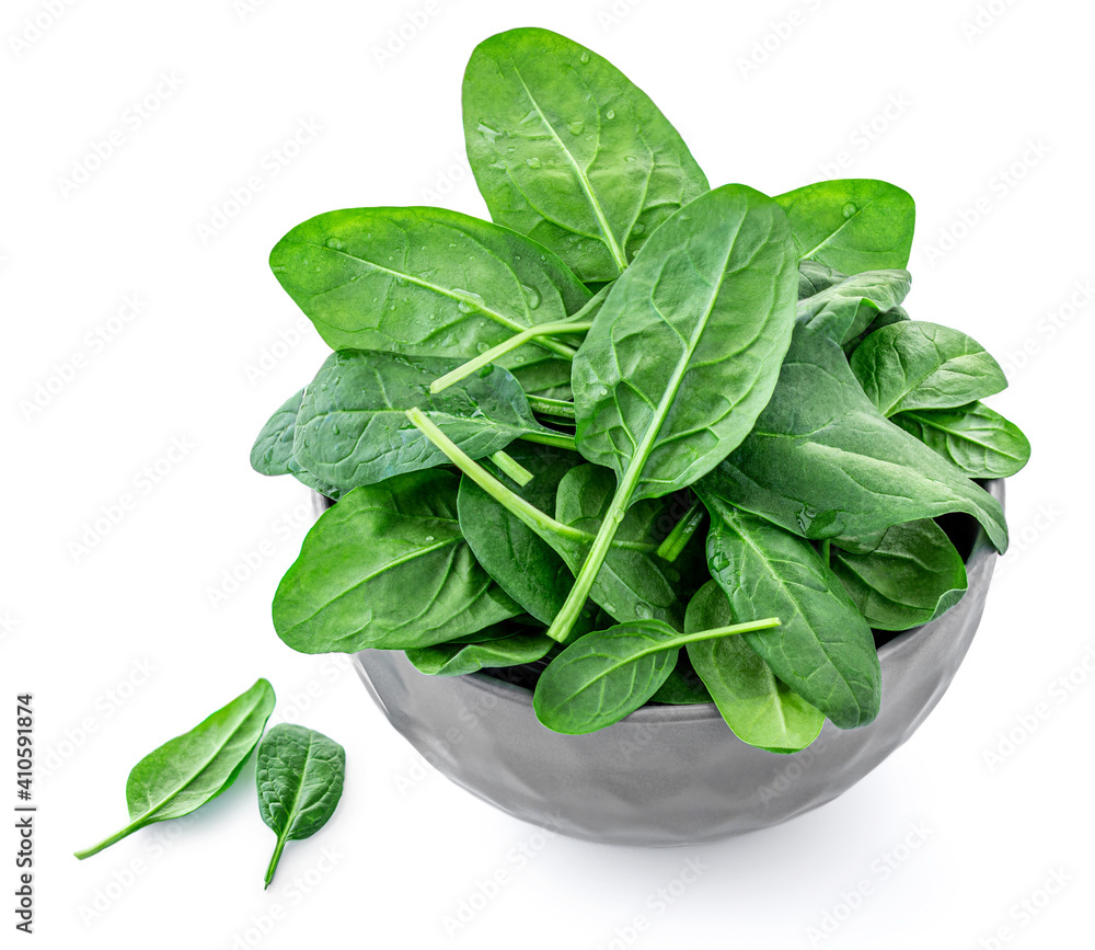 Spinach leaves in a bowl isolated on white background. Spinach leaf Top view. Flat lay. Dieting lunch food. Spinach leaves in a bowl isolated on white background. Spinach leaf Top view. Flat lay. Dieting lunch food.