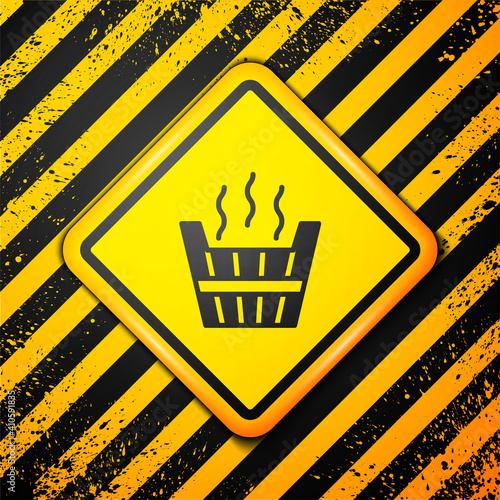 Black Sauna bucket icon isolated on yellow background. Warning sign. Vector.