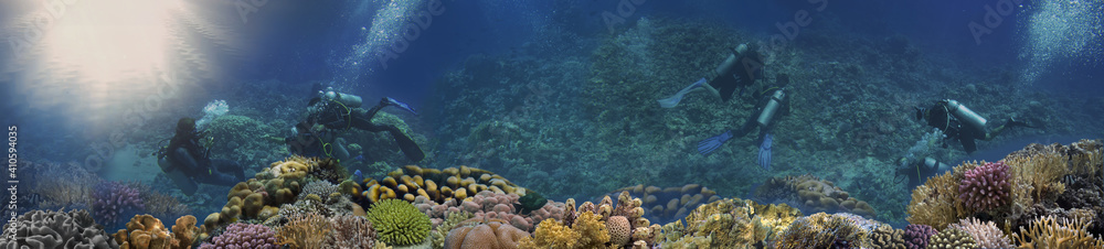 Fototapeta premium Coral reef underwater panorama with Group Of Scuba Divers Exploring Coral