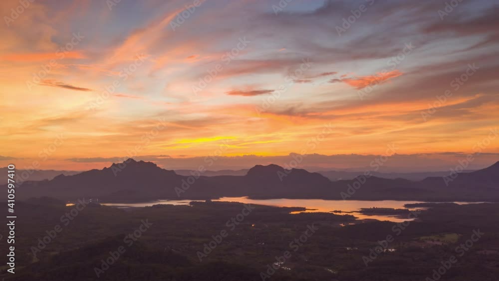 Hyper lapse 4K, Aerial view of drone evening view dramatic sky, sunset behind the mountains, colorfully, Mae Moh, Thailand. Hyper lapse 4K, Aerial view of drone evening view dramatic sky, sunset behind the mountains, colorfully, Mae Moh, Thailand.