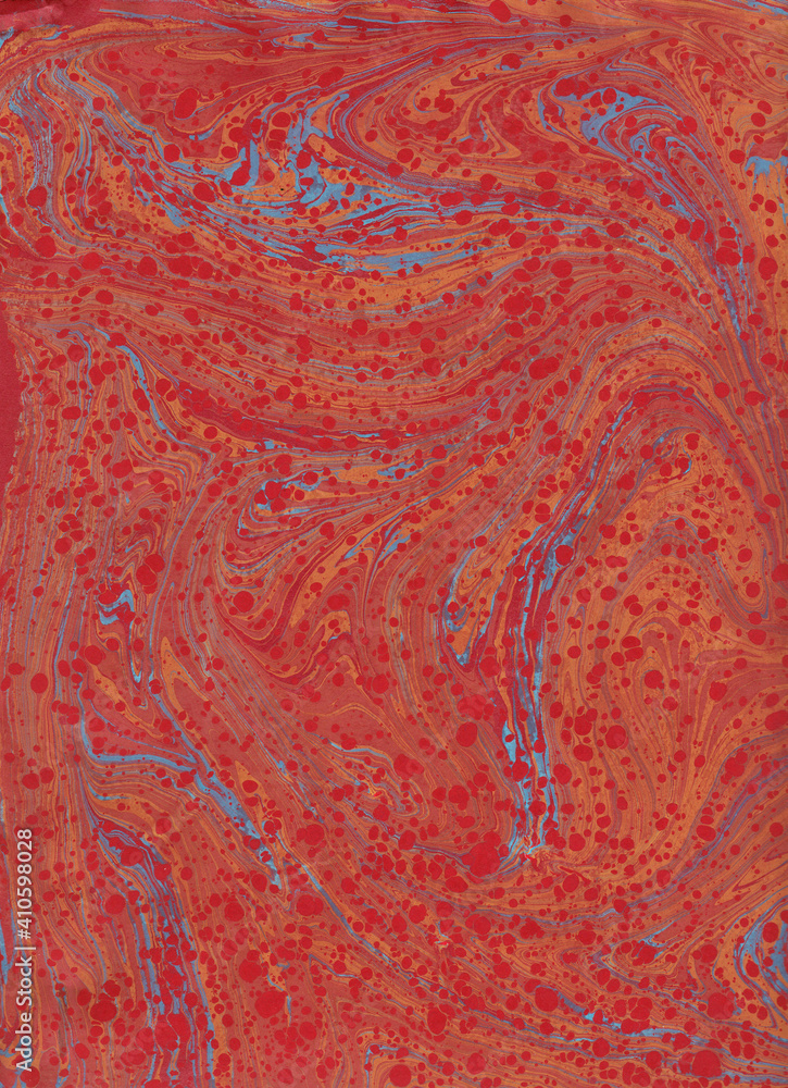 Abstract paper marbled painting, in red and orange with touch of turquoise, swirls and flows Abstract paper marbled painting, in red and orange with touch of turquoise, swirls and flows