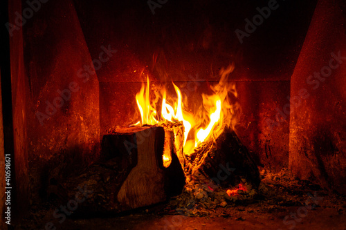 Fireplace with wood burning in winter