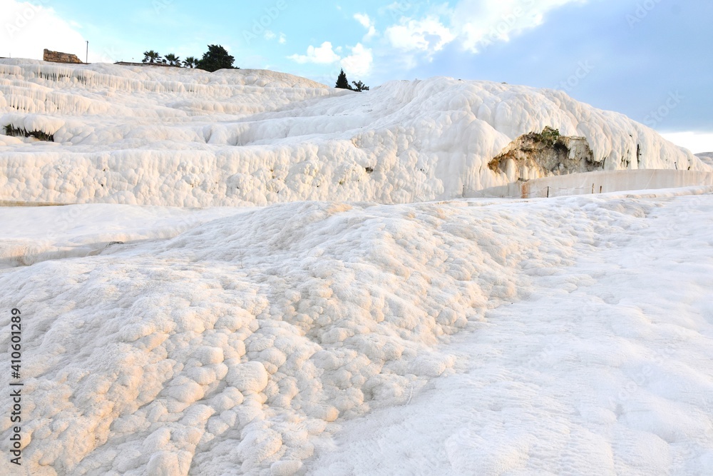Amazing travertine pools and terraces in Pamukkale. Cotton castle in Turkey, Denizli Province. Beautiful natural view of famous white rocks in Pamukkale Amazing travertine pools and terraces in Pamukkale. Cotton castle in Turkey, Denizli Province. Beautiful natural view of famous white rocks in Pamukkale