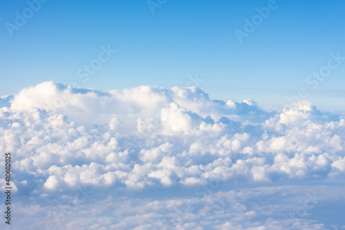 Incredible view of fluffy clouds from the height of the plane.