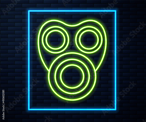 Glowing neon line Gas mask icon isolated on brick wall background. Respirator sign. Vector.