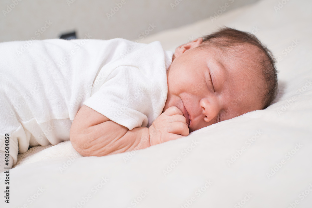 Cute, small and adorable newborn baby girl sleeping Cute, small and adorable newborn baby girl sleeping