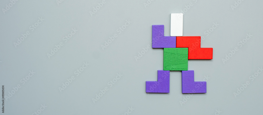 Man shape block of colorful wood puzzle piece on gray background. logical thinking, business logic, Conundrum, decision, solutions, rational, and idea concepts Man shape block of colorful wood puzzle piece on gray background. logical thinking, business logic, Conundrum, decision, solutions, rational, and idea concepts