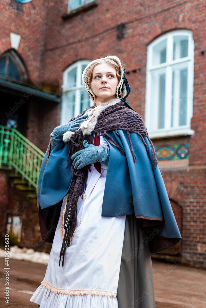 Outdoors portrait of a victorian lady walking old city Outdoors portrait of a victorian lady walking old city