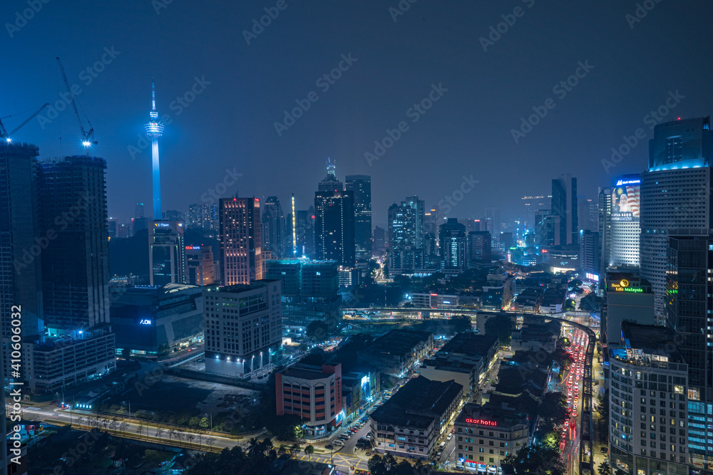 Naklejka premium The illuminated skyline of Kuala Lumpur in Malaysia at night