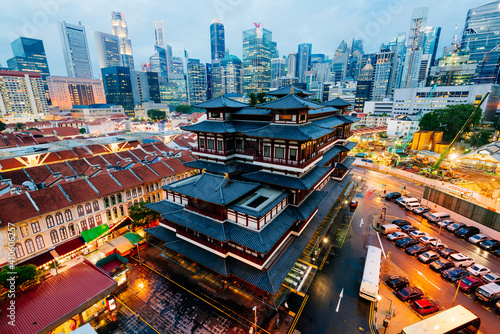 Photography Buddha Toothe Relic Temple in Chinatown with Singapore`s business district in the background