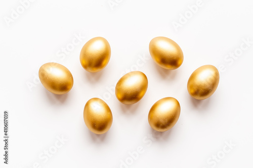 Golden Easter eggs isolated on white background. Top view