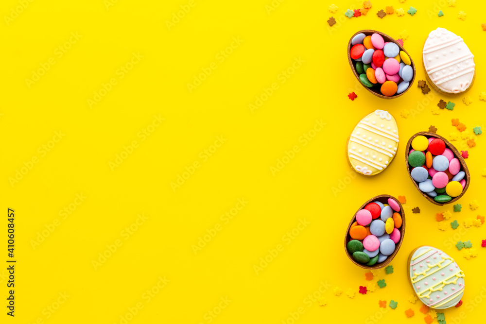 Happy Easter with chocolate eggs and sweets. Space for text