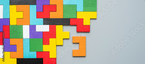 geometric shape block with colorful wood puzzle piece background. logical thinking, business logic, Conundrum, decision, solutions, rational, mission, success, goals and strategy concepts