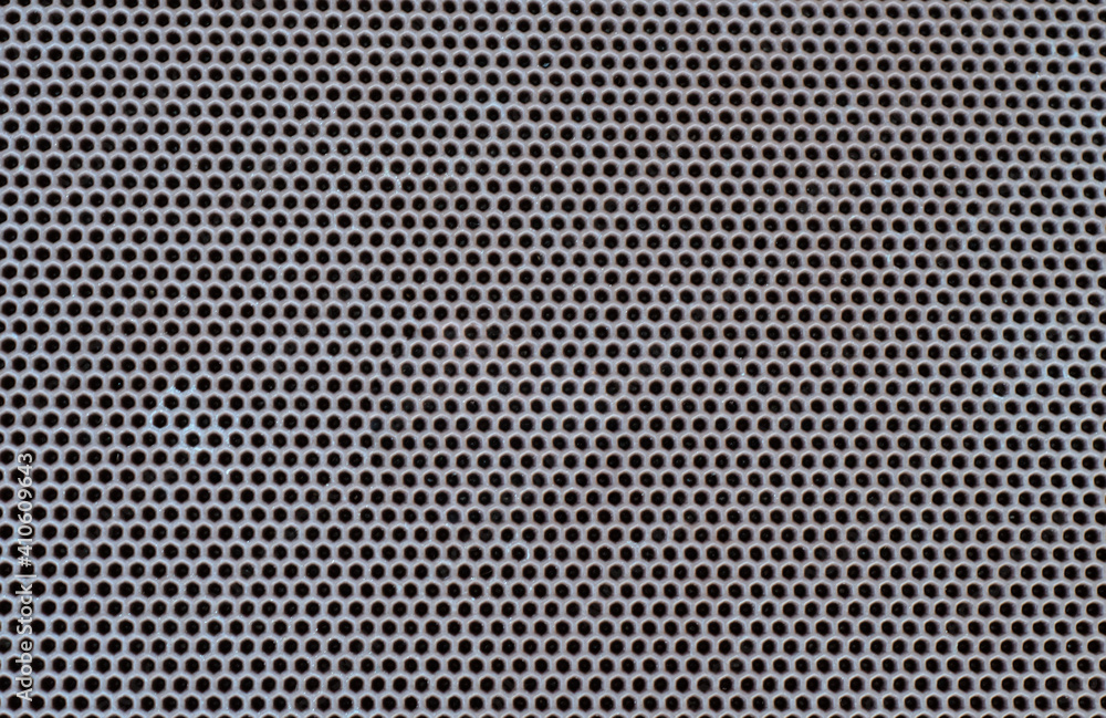 The surface of the material of the door mat, top view. Grey Rubber Texture. rubber band or background of the conveyor belt of the treadmill. copy the space. The surface of the material of the door mat, top view. Grey Rubber Texture. rubber band or background of the conveyor belt of the treadmill. copy the space.
