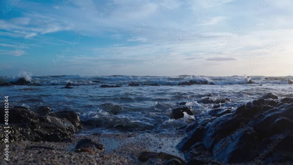Waves hitting the rocky beach in slow motion Waves hitting the rocky beach in slow motion
