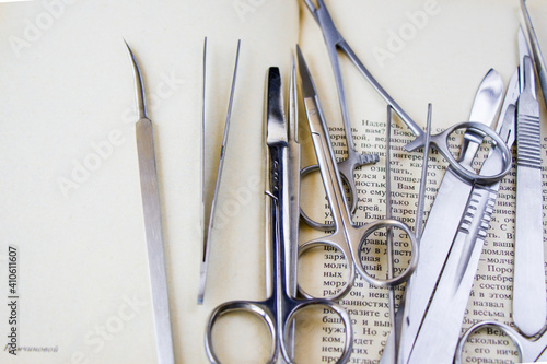 Top view of dissection kit tools on an opened book