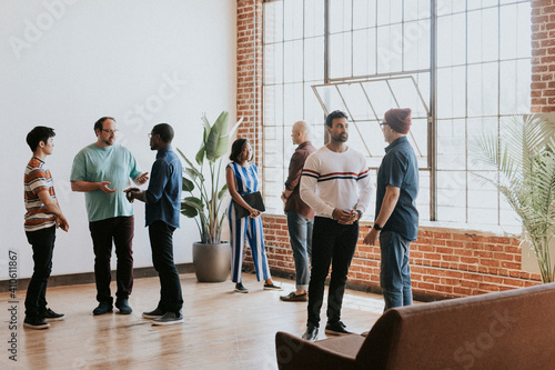 Diverse people talking in groups during a break