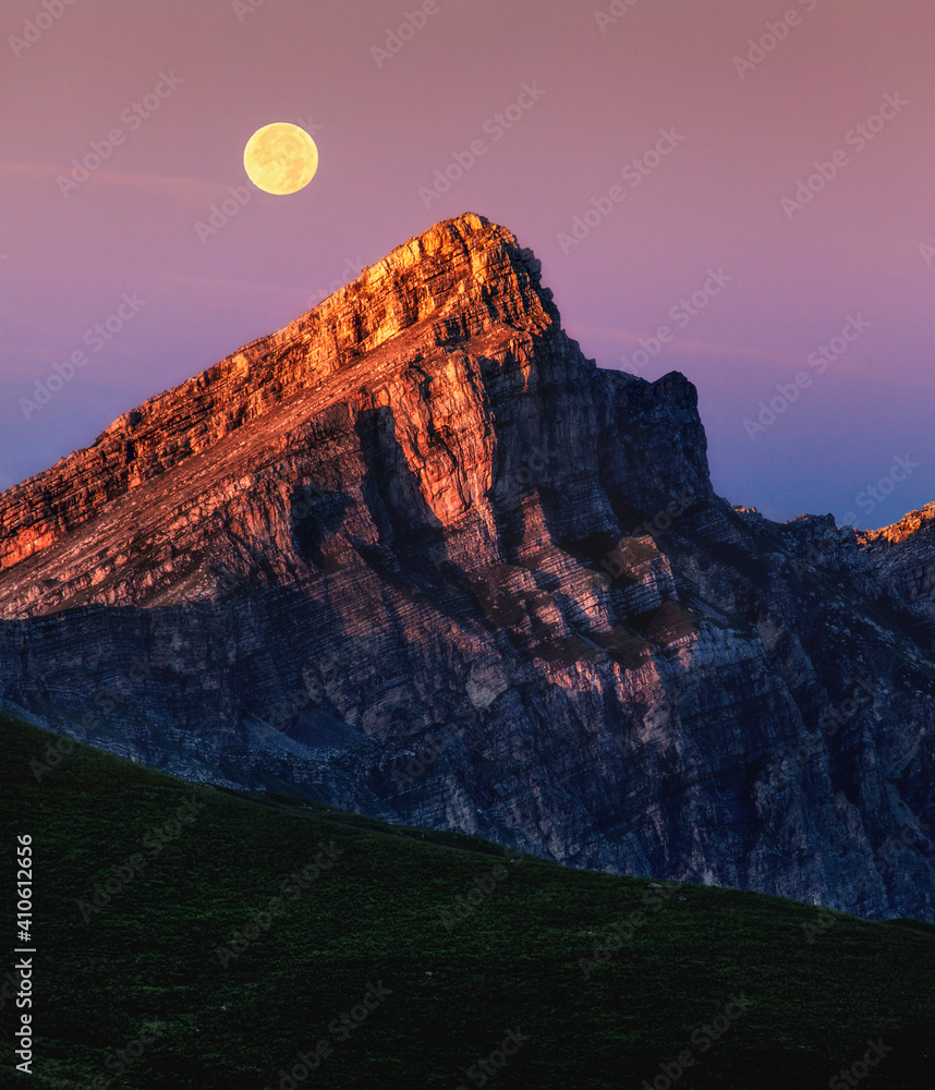 sunset in the mountains with moon