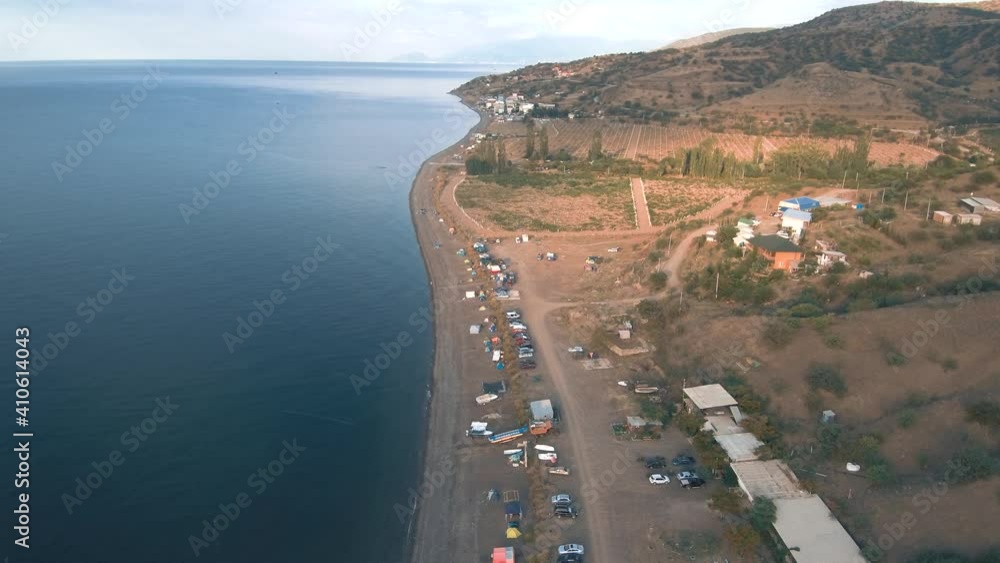 4K Top view Aerial view drone over beach sea. rest on a wild beach