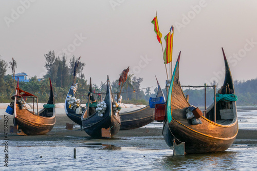 Fotografija Landscape view of traditional wooden fishing boats known as moon boats glowing a