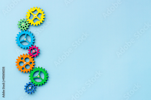 Teamwork concept. Gears connect in working mechanism, overhead view photo