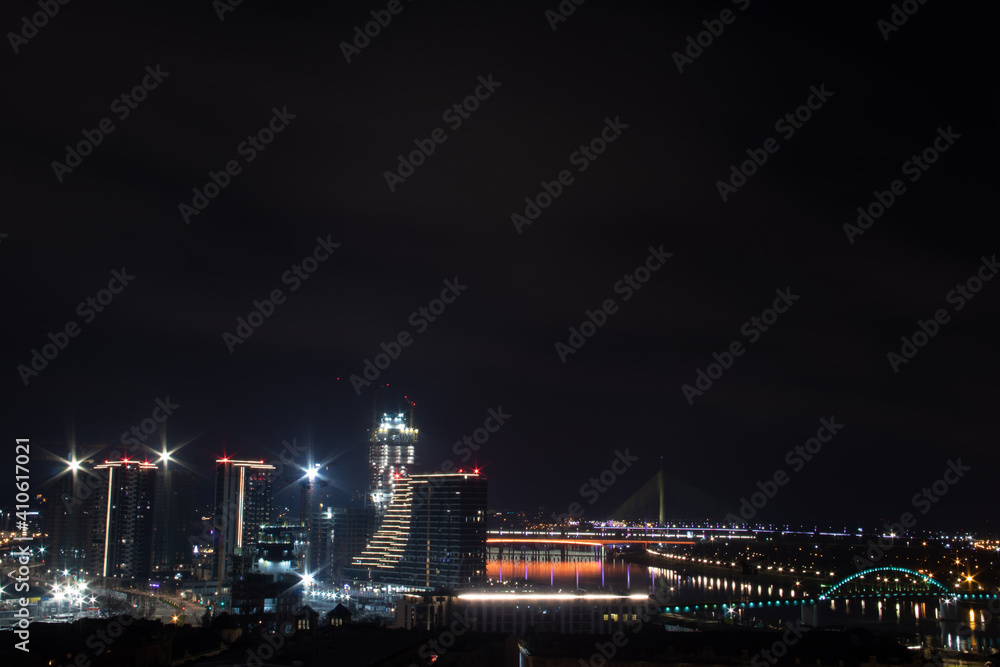 Panoramic night view on Belgrade, (Beograd in Serbian), on river Danube and Sava and bridges over them, view at old but also new part of town