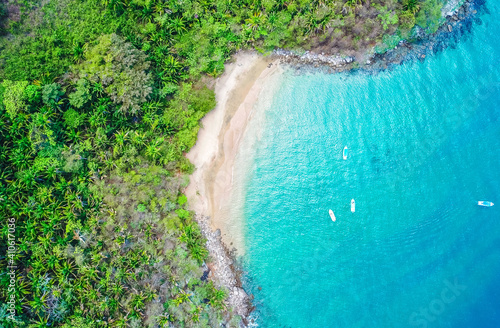 Aerial view of abay with turquoise water surrounded by trees photo