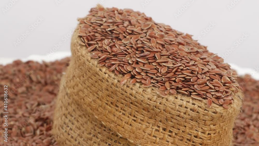 Close rotating view of brown bag filled with flax seeds Close rotating view of brown bag filled with flax seeds