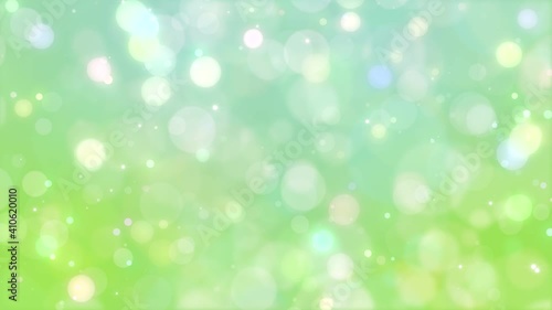 Glittering green particles. 4K background material for loop playback photo