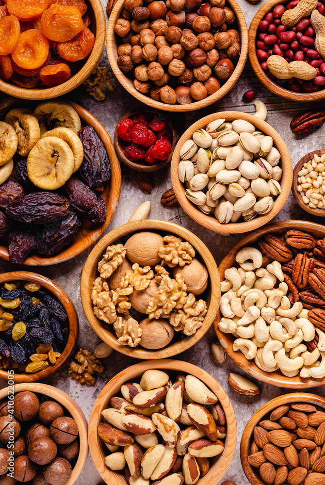 Various Nuts and dried fruits in wooden bowls. Various Nuts and dried fruits in wooden bowls.