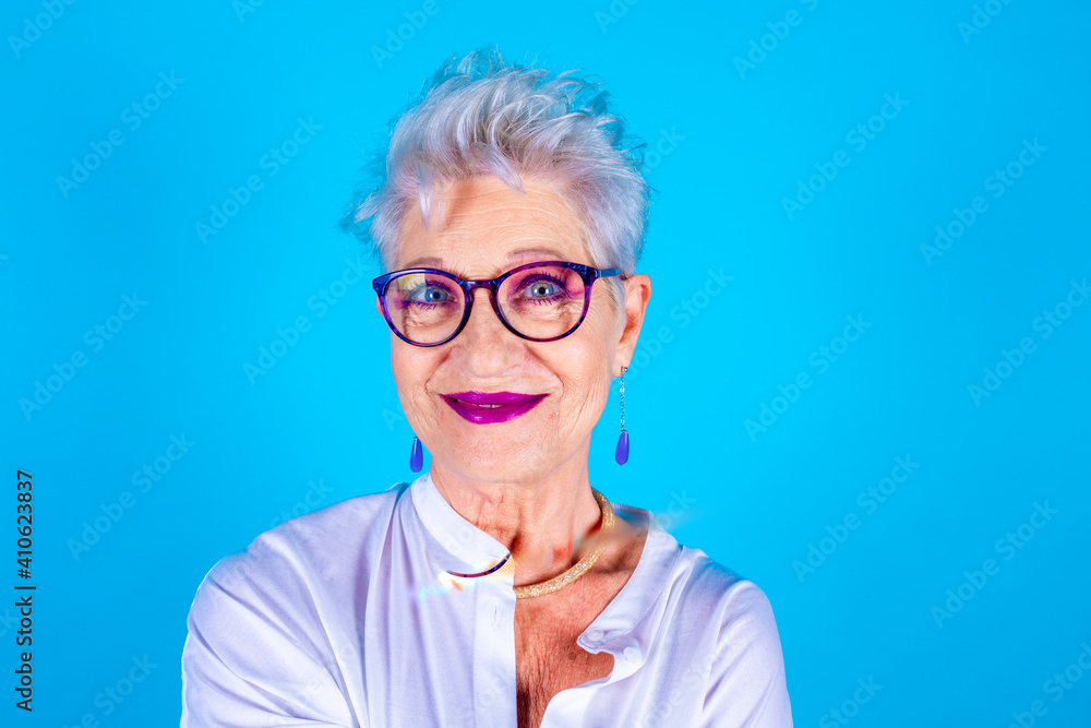 Portrait of friendly old woman expressing positive emotions